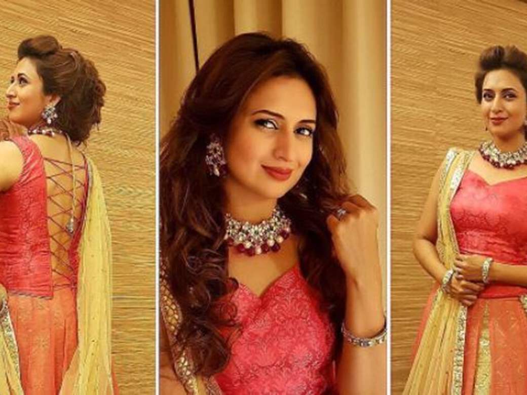 woman wearing red and gold-colored rhinestone dress with hijab headdress Divyanka  Tripathi #Wedding #Bride #Lehenga… | Divyanka tripathi wedding, Bride,  Wearing red