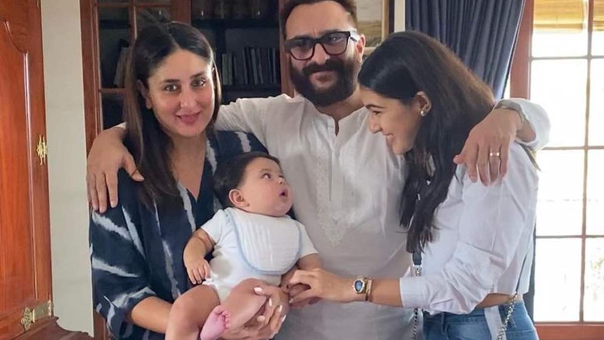 Jeh looks like a cute button in mommy Kareena's arms