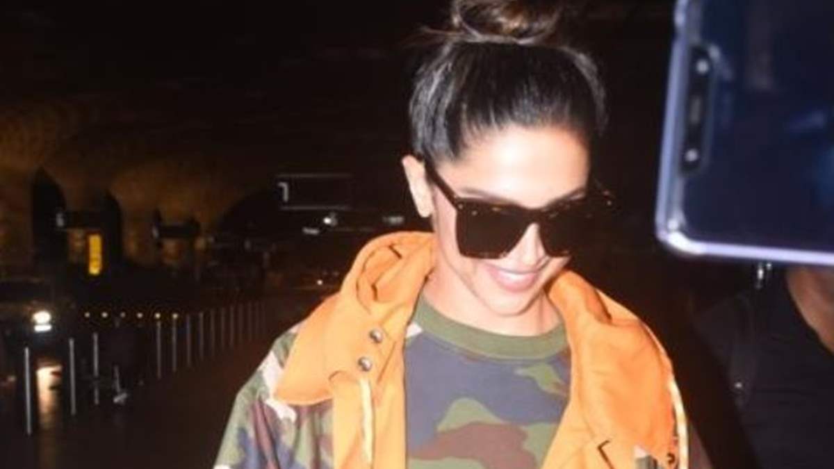 5306 deepika padukone slays her airport look in a chic camouflage trench coat these pictures are a proof