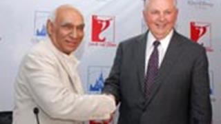 Yash Chopra and Chairman of The Walt Disney Studios- in an agreement. Thumbnail
