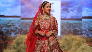  Shehnaaz Gill radiates regal vibes in a red lehenga as she graces the ramp for the first time