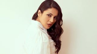 Shehnaaz Gill strikes stunning poses dolled up in a pristine white ensemble