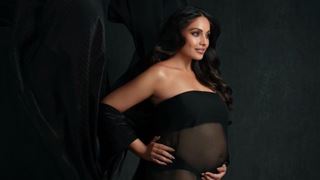 Mom-to-be Bipasha Basu looks ravishing as she flaunts her baby bump in a sheer black dress