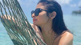 Mouni Roy takes a dip in the green sea oozing hotness; pens a cryptic note