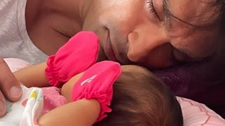 Karan Singh Grover reveals baby's pic as he puts her down to sleep