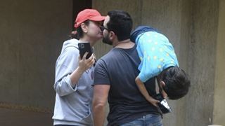 Saif Ali Khan steals a kiss from wifey Kareena Kapoor while Taimur hangs on daddy's shoulder