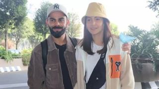 Virat Kohli & Anushka Sharma ace their airport look once again in shades of brown; poses for the paps