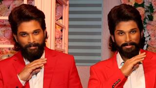 Allu Arjun strikes the iconic "thaggede le" pose with his wax statue at Madame Tussauds in Dubai