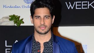 Why does Sidharth Malhotra want to visit a PSYCHIC?