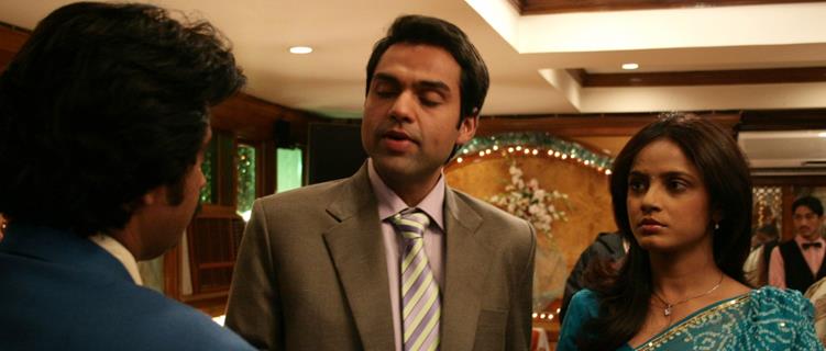 Abhay Deol and Neetu Chandra talking to a man