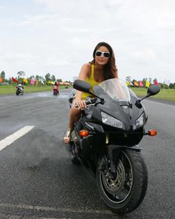 Hottie Kareena sitting on a bike