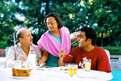 Ranjita Chakravarty serves food to Anupam and Anubhav