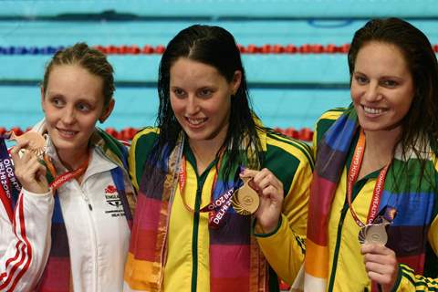 Australian Alica Jayne(Gold) and Emily Jane(Silver) with England,s Francesca Jeanafter(Bronze) , in the Swimming Women 100m Freestyle event at the 19 Commonwealth Games in New Delhi