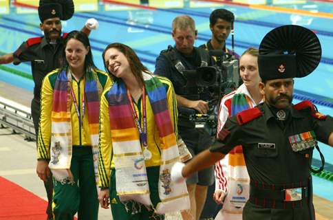 Australian Alica Jayne(Gold) and Emily Jane(Silver) with England,s Francesca Jeanafter(Bronze) , in the Swimming Women 100m Freestyle event at the 19 Commonwealth Games in New Delhi on Wednesday