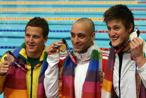 England,s James Francis Goddard after wining the  gold with New Zealander Gareth Kean (Silver) and Australian Ashley Delaney (bronze), in the Swimming 200m Backstroke event at the 19 Commonwealth Games in New Delhi on Wednesday