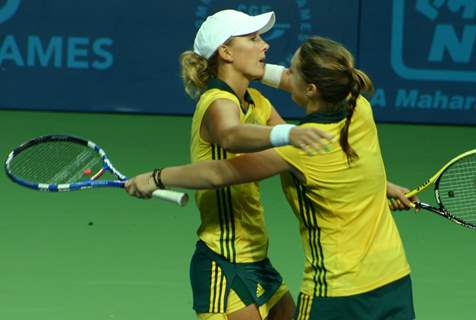 Australia's Anastasia Rodionova  and Sally Peers  after winning the gold over compatriots Olivia Rogowska and Jessica Moore during the final match for the women's doubles gold medal at the 19th Commonwealth Games,in New Delhi