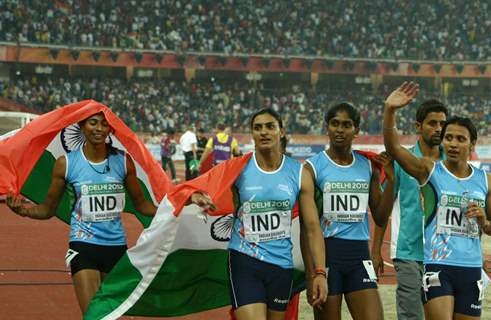 The gold medal winning Indian 4 x 400 relay team celebrates after the women's 4 x 400 relay final at the 19th Commonwealth Games in New Delhi on Tuesday 12 Oct 2010