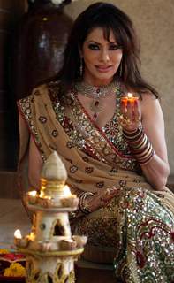 Bollywood actress Poonam Jhawer covered photoshoot for Festival “Deepawali” in between Colourful Rangoli & Candles