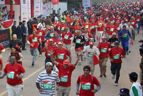 Participants during the Delhi Half Marathon, in New Delhi on Sunday