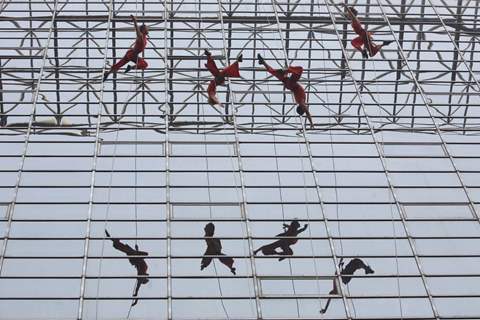 American Dance troupe Project Bandaloop during their aerial dance performance at LIC Building,in New Delhi on Friday