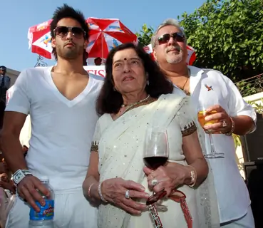 Dr.Vijay Mallaya with his son Siddharth and Models  at Kingfisher Calendar Launch 2011