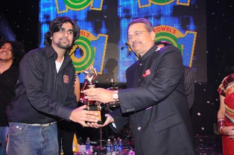 Growel Group Chairman Mr. Umesh More awarding the winner of Growel Idol