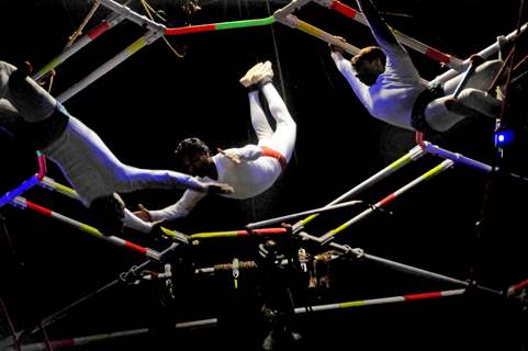 Kolkata: Circus performers perform skills during the trapeze round in Olympic Circus held in Kolkata in the eve of up coming New Year 2011, on Friday. .