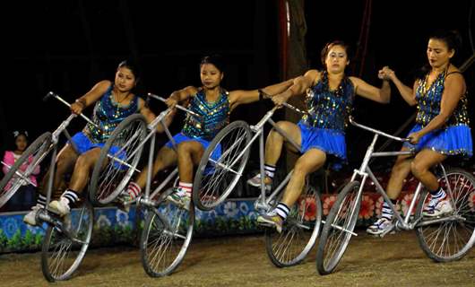 Kolkata: Circus performers perform skills during the cycle round in Olympic Circus held in Kolkata in the eve of up coming New Year 2011, on Friday. .