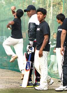 West Indies cricketer Brian Lara gives tips to young cricketers at Ferozshah Kotla  stadium in New Delhi on Tuesday. .