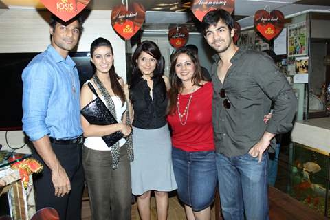 Karan V Grover, Simple Kaul and Khushboo Garewal at IOSIS event with underprivileged children