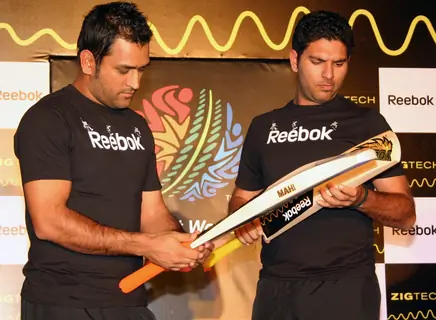 Cricketers M S Dhoni and Yuvraj Singh at a promotional event in New Delhi on Wed 2 Feb 2011. .