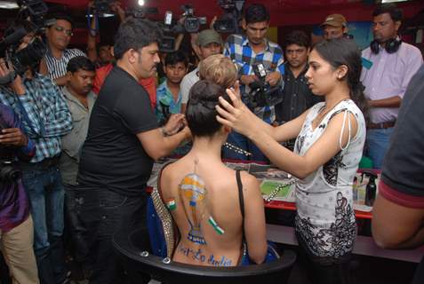 Sofiya Hayat gets her bare back painted at Shiva's saloon. .