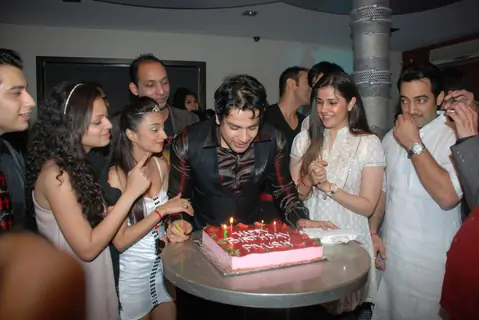 Piyush Sachdev cutting cake on his birthday