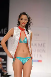 A model displays designer Vivek Karunakaran's creations during the Lakme Fashion Week day 2 in Mumbai. .