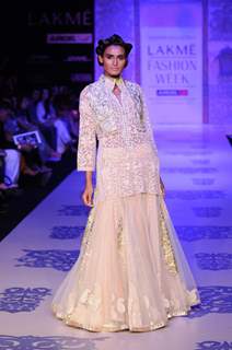 A model displays designer Manish Malhotra's creations during the Lakme Fashion Week day 2 in Mumbai. .