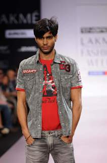 A model walks the runway at the Energie show at Lakme Fashion Week day 2 in Mumbai. .