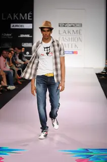 A model walks the runway at the Energie show at Lakme Fashion Week day 2 in Mumbai. .
