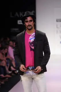 A model walks the runway at the Energie show at Lakme Fashion Week day 2 in Mumbai. .