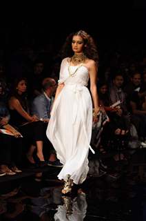 Dia Mirza displays designer Rocky S's creations during the Lakme Fashion Week day 4 in Mumbai. .