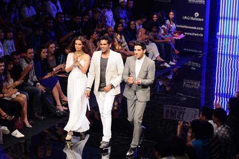 Dia Mirza and Zayed Khan displays designer Rocky S's creations during the Lakme Fashion Week day 4 in Mumbai. .