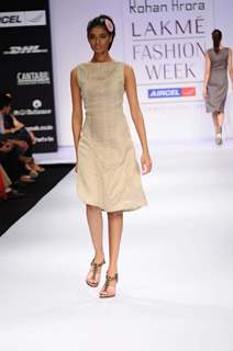 A model displays designer Rohan Arora's creations during the Lakme Fashion Week 2011 Day 5 in Grand Hyatt, Mumbai. .