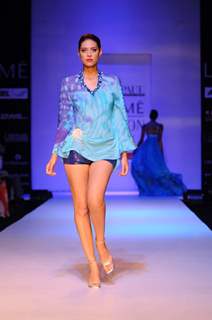 A model displays designer Satya Paul's creations during the Lakme Fashion Week 2011 Day 5 in Grand Hyatt, Mumbai. .