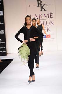 Models display designer Prabhat kumar's creation during the Lakme Fashion Week 2011 Day 5 in Grand Hyatt, Mumbai. .