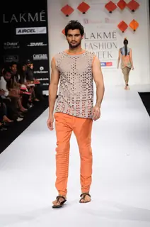 A model displays designer Abhishek Dutta's creations during the Lakme Fashion Week 2011 Day 5 in Grand Hyatt, Mumbai. .
