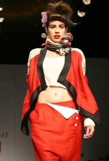 A Model showcasing designer Urvashi Kaur's creation at the Wills Lifestyle India Fashion Week autumn inter 2011 in New Delhi on Wed 6 April 2011. .