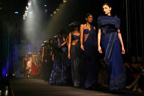 Models showcasing designer Tarun Tahiliani's creations at the Wills Lifestyle India Fashion Week autumn winter 2011,in New Delhi on Wednesday. .