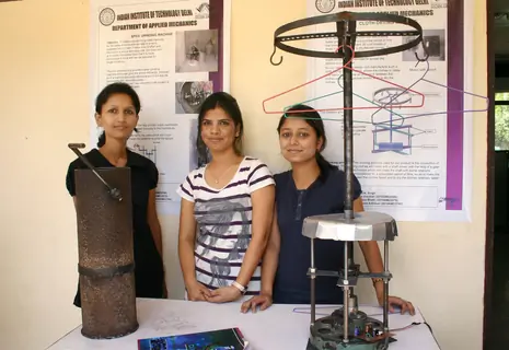 A IIT Delhi students with their innovated a Manual Spice Grinding Machine and a Cloth Drying Machine at the Open House 2011 in New Delhi on Saturday. .