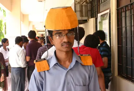 A IIT Delhi student with his innovated Head Load Transmitter at the Open House 2011 in New Delhi on Saturday. .
