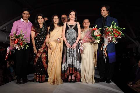 Nita Ambani, Kajol and Vivek Oberoi walk the ramp for Shaina NC and Manish Malhotra at the Pidilite-CPAA charity fashion show. .