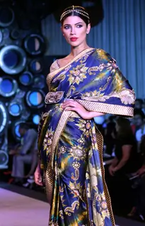 Model showcasing designer J J Valaya's creation at the Synergy one Delhi Couture Week,in New Delhi